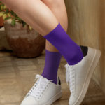 woman-with-crossed-legs-wearing-purple-socks